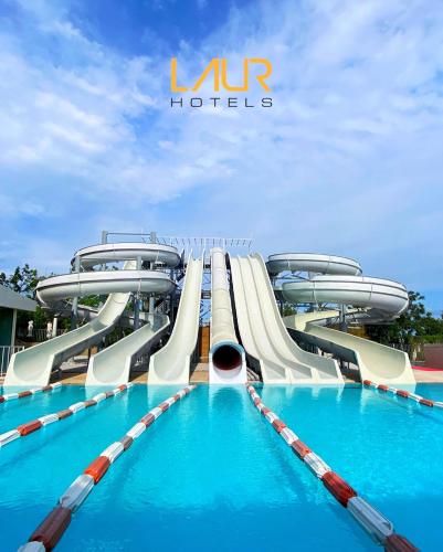 a water slide in a pool at a resort at LAUR HOTELS Experience & Elegance in Didim