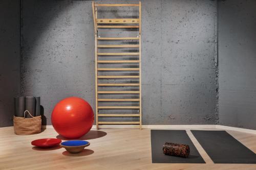 a room with a red ball and a ladder at Hotel Linde in Maria Wörth
