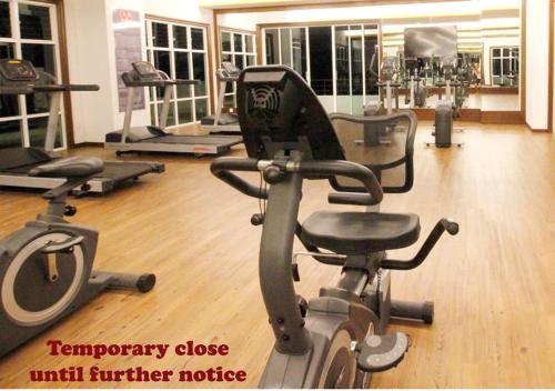 a gym with two exercise bikes in a room at H2H - Holland Cottage - Majestic Ipoh - 7pax in Ipoh