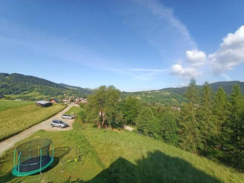 an aerial view of a playground on a hill at Domek w malowniczych Pieninach in Krościenko