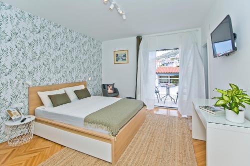 Postel nebo postele na pokoji v ubytování Hvar Deluxe Rooms