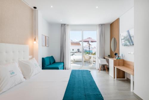 Postel nebo postele na pokoji v ubytování Nerja VG Hostal Boutique