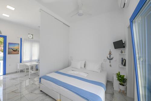 Ένα ή περισσότερα κρεβάτια σε δωμάτιο στο Rose of Tinos
