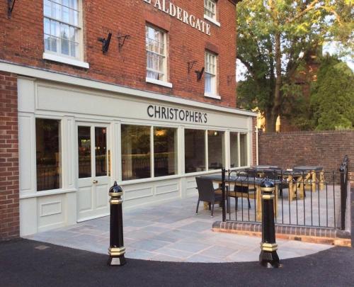 a store front of a restaurant with tables in front of it at The Peel Aldergate in Tamworth
