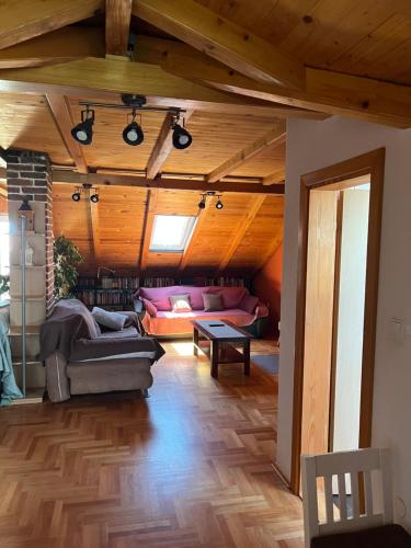 a living room with a couch and a table at Apartment Ružica in Sukošan