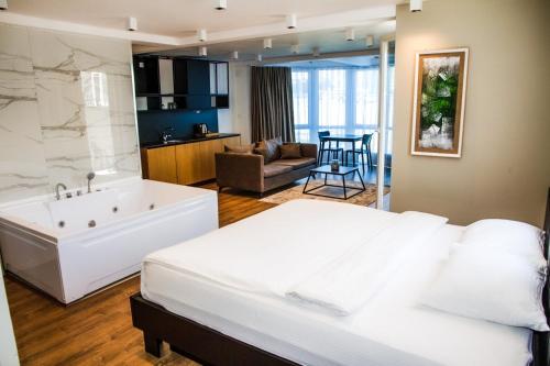 Ένα ή περισσότερα κρεβάτια σε δωμάτιο στο Swiss Apartments Prishtina