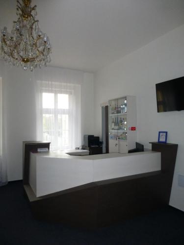 a room with a white counter and a window at Penzion U sv. Kryštofa in Prague
