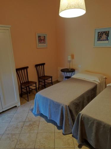 Postel nebo postele na pokoji v ubytování Agriturismo Le Cantine