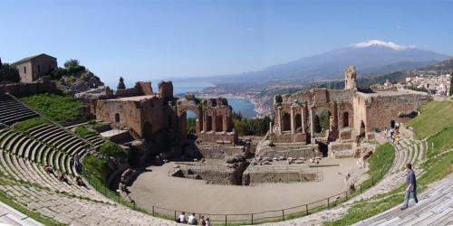 an amphitheater with a mountain in the background at Casa Pasitea in Taormina