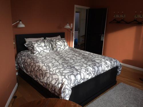 Кровать или кровати в номере Fenêtre sur Tilff
