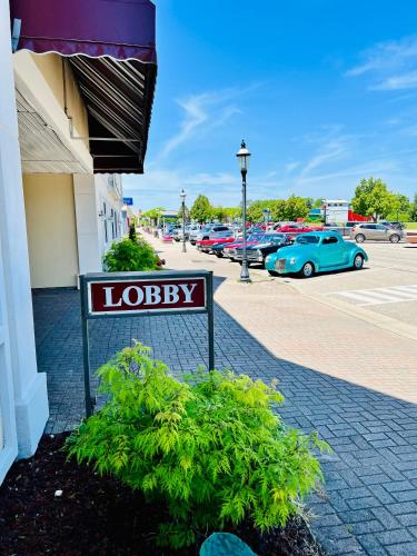 a sign for a library in a parking lot at Court Plaza Inn & Suites of Mackinaw in Mackinaw City