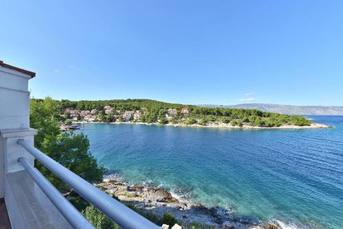 a view of the ocean from a balcony at Apartments Habek in Vrboska