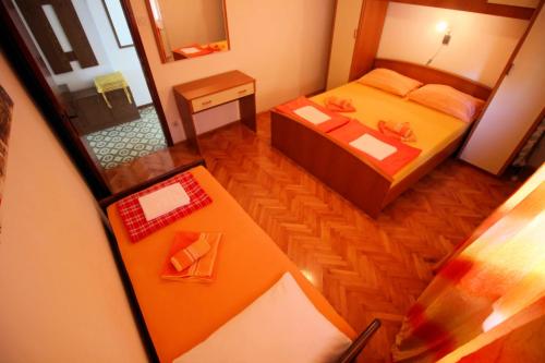 Postel nebo postele na pokoji v ubytování Apartmens Adriana