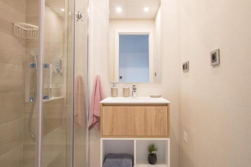 a bathroom with a sink and a shower at Waves apartment - relax in Costa Blanca in Benidorm