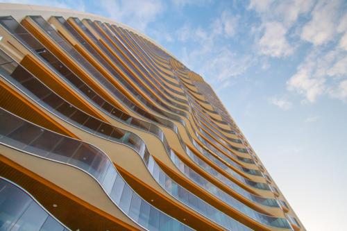 a building with balconies on the side of it at Waves apartment - relax in Costa Blanca in Benidorm
