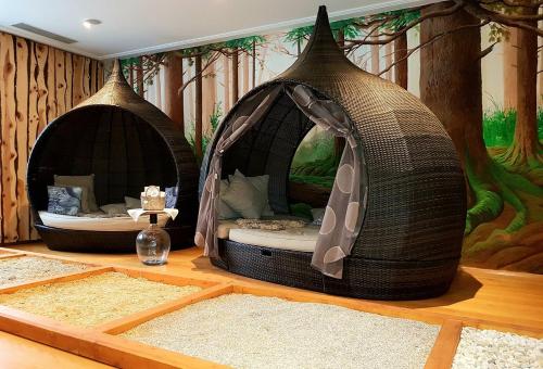 a room with two igloo beds in the middle of a room at Hotel in the HEART of the Alps in Uttendorf