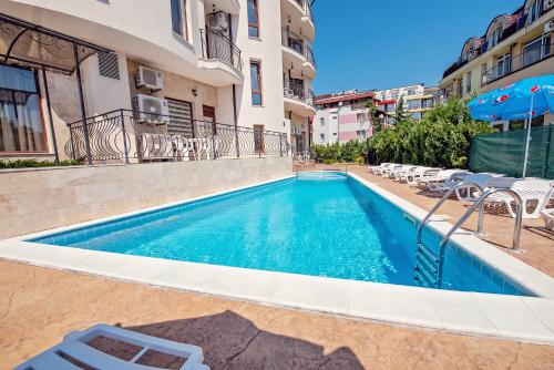 a swimming pool in the middle of a building at Hotel Santa Maria in Obzor