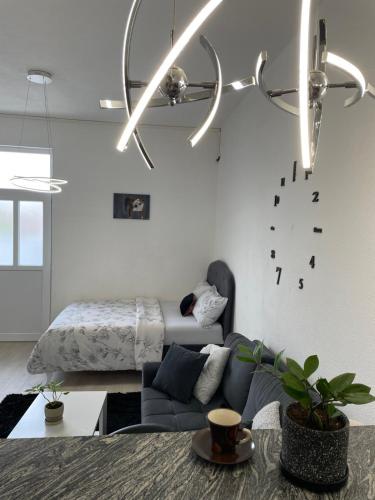 a living room with a couch and a ceiling fan at Apartmani Andric in Trebinje