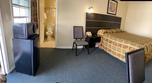 Ένα ή περισσότερα κρεβάτια σε δωμάτιο στο Penn Amish Motel