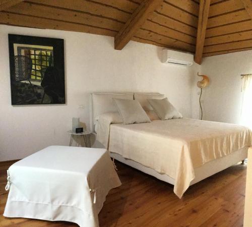 Кровать или кровати в номере La Foresteria di Villa Gorgo