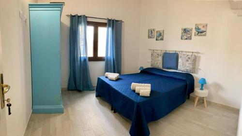 Ένα ή περισσότερα κρεβάτια σε δωμάτιο στο PRIMA LUCE