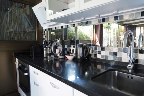 A kitchen or kitchenette at Bungalow Atos With Private Garden