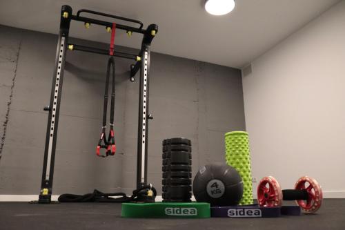 a gym with a bunch of equipment in a room at Hotel hcp in Calella de Palafrugell