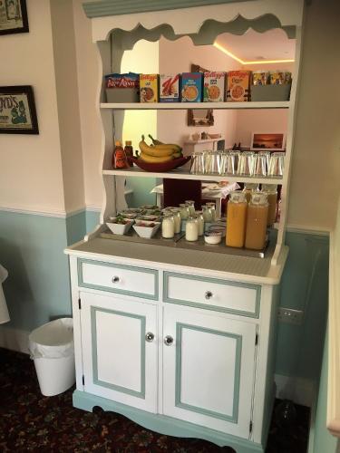 a toy cabinet with food on it in a room at Loggans Lodge in Hayle