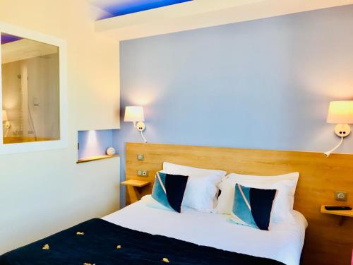 Postel nebo postele na pokoji v ubytování Hôtel Outre-Mer - Villa Le Couchant