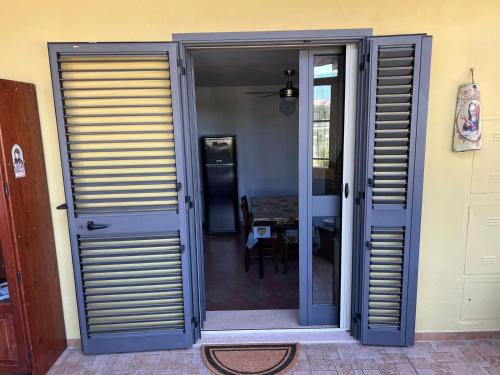 an open door to a room with a table at Casanostra in San Vito Chietino