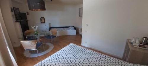 a living room with a glass table and a dining room at Apartamentos Foz O Porto in Porto