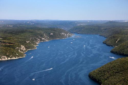 an aerial view of a river with boats in it at Villa Asi in Vrsar