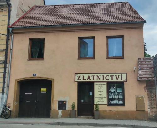 a building with a sign on the front of it at Apartmán Extoll in Třeboň