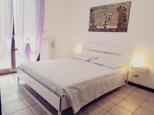 Ένα ή περισσότερα κρεβάτια σε δωμάτιο στο Appartamento Viserba mare/fiera