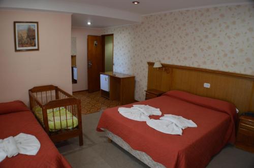 Una cama o camas en una habitación de Complejo Turístico CapArcona