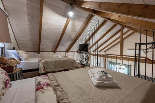 a room with two beds in a attic at Chalet edelweiss preveza in Preveza