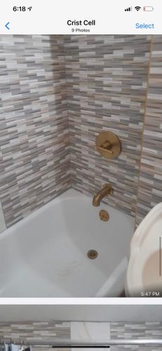 a bathroom with a bath tub with a sink at Luxury Villa rentals in Montego Bay