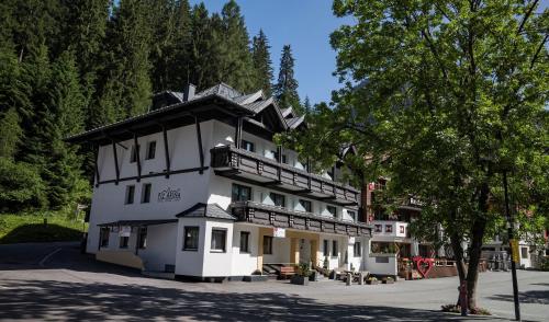 a large white building with a black roof at Piz Arina in Ischgl