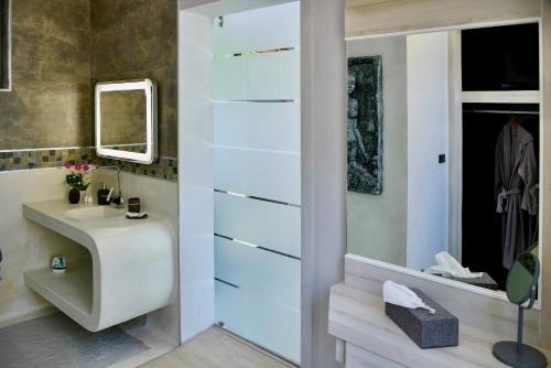 a bathroom with a sink and a mirror at Paradise Villa Elysium in Koh Samui