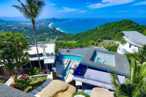 an aerial view of a house with a swimming pool at Paradise Villa Elysium - Sea View Infinity Pool with Waterfall & Jacuzzi in Koh Samui 