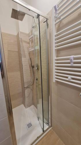 a shower with a glass door in a bathroom at Casa vacanze Il Mandarancio in Modica