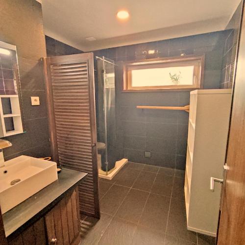 a bathroom with a shower and a sink at Varandas do Mar in Arcozelo