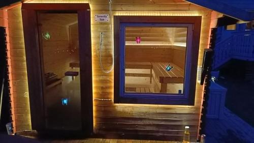 a view of a sauna in a building with a mirror at Bubbles Breakfast and Spa in Sandefjord