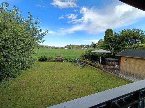 a view of a yard from a balcony at Bubbles Breakfast and Spa in Sandefjord