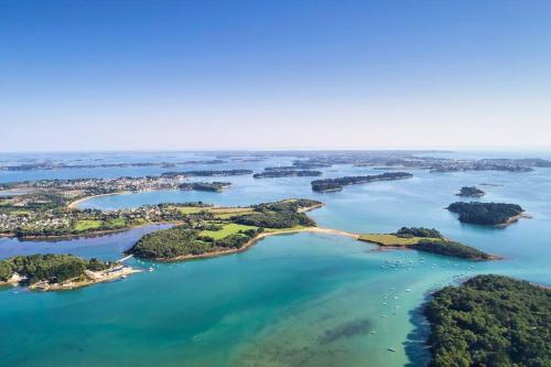 an aerial view of a group of islands in the water at Tiny house sur terrain boisé à 10 mn de la mer in Férel