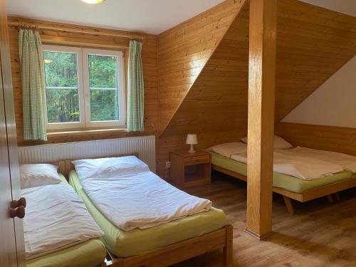 Postel nebo postele na pokoji v ubytování Alba Apartmany Železná Ruda