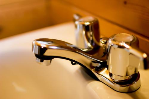 a bathroom sink with a chrome bathroom faucet at Mt. Revelstoke Alpine Chalets in Revelstoke