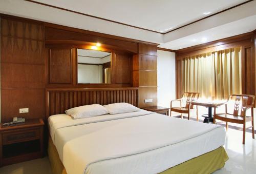Giường trong phòng chung tại The A.A. Pattaya Residence