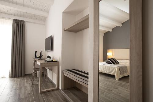 Säng eller sängar i ett rum på Palazzo Ducale Suites