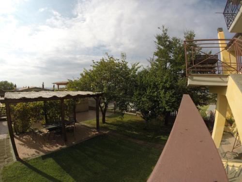a view of a yard with a gazebo at Agriturismo Casale Di Gricciano in Cerveteri